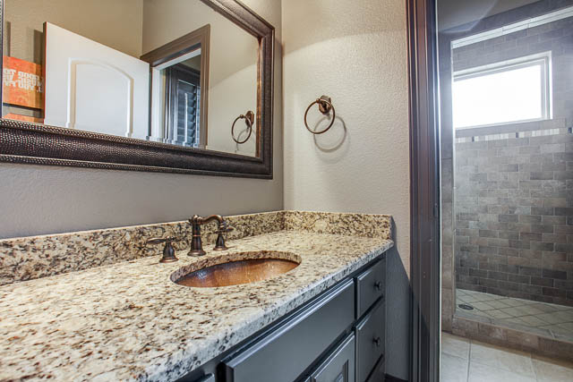 The home features 4 full bathrooms. Furry friends can enjoy a Southern Living inspired dog kennel downstairs.