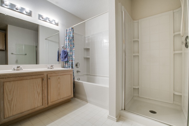 Notice the dual sinks and separate shower.