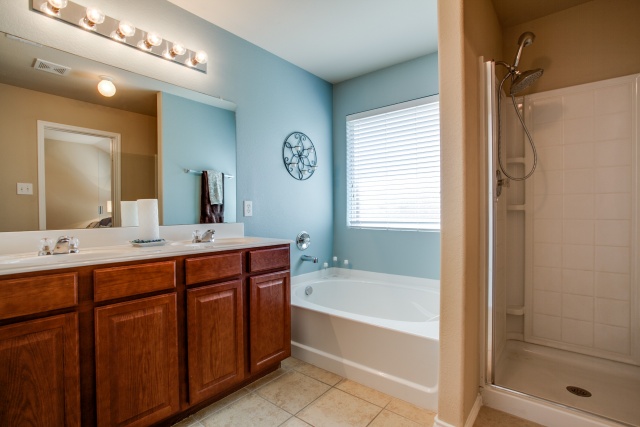 Relax in the garden tub! Enjoy features like separate vanities and a separate shower.