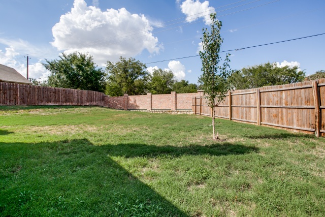 The fenced backyard is a great size.