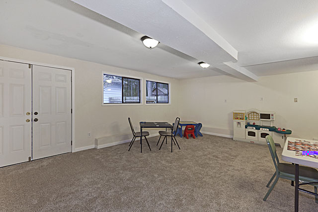 New carpet and recently remodeled game room with wet bar