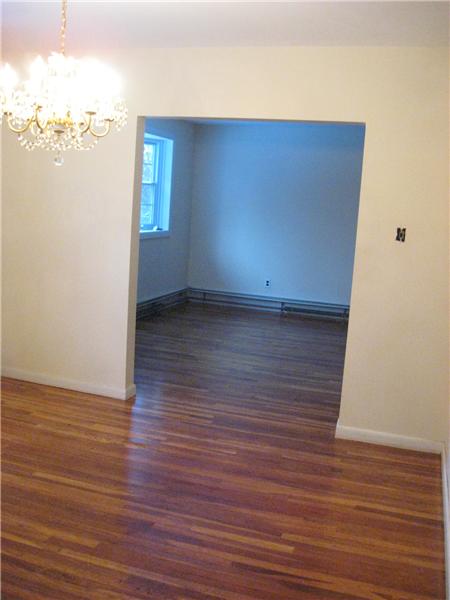 Dining room with hardwood floors.