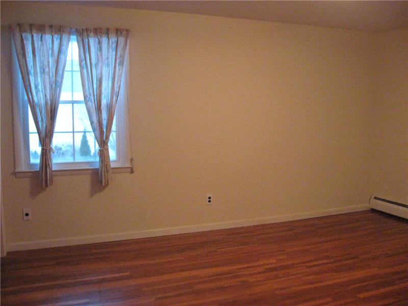 Bedroom with hardwood floors.