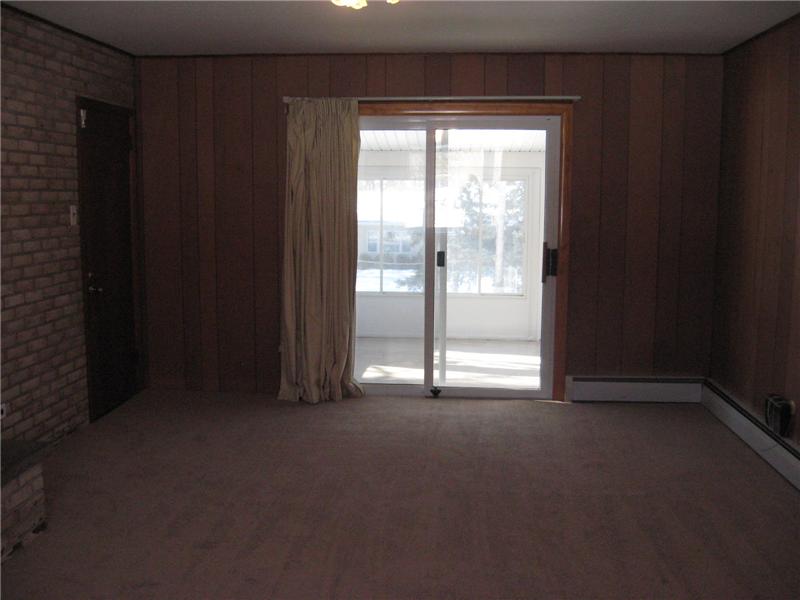 Family room with sliders to the three season porch.