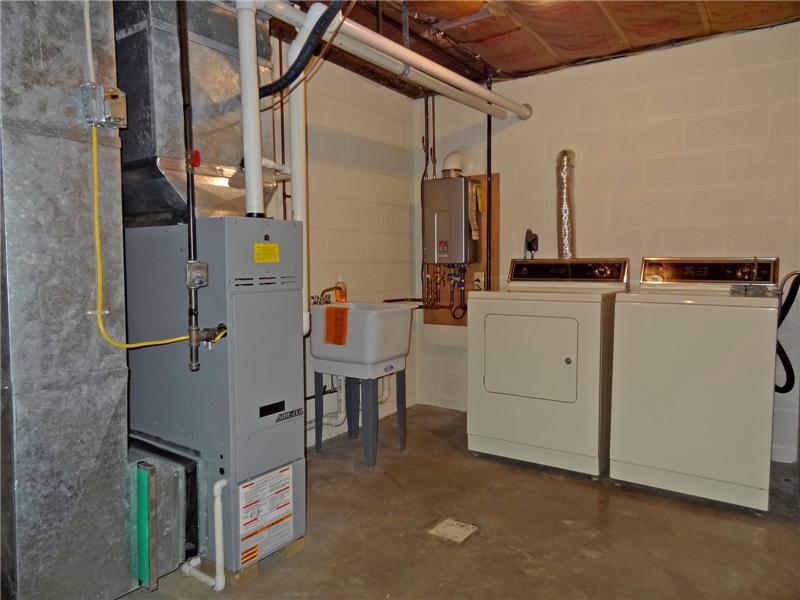 High Eff Furnace, Tankless Hot Water, & included W/D & Laundry Tub