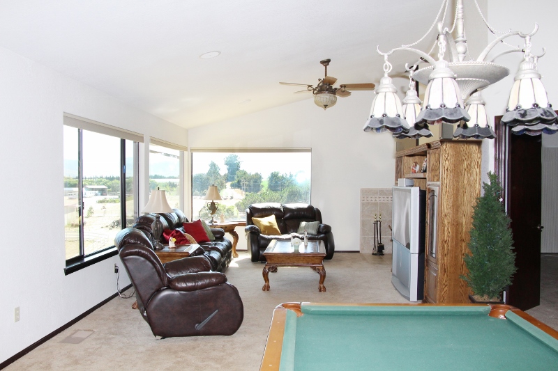 Spacious family / game room with wood burning stove and pool table