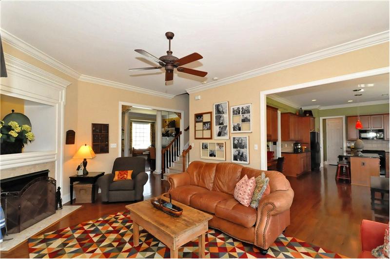 Spacious greatroom is well appointed with gorgeous wood floors & heavy millwork