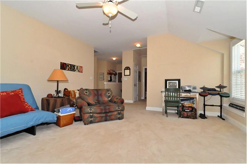 Bonus room has wall-to-wall carpeting & a vaulted ceiling