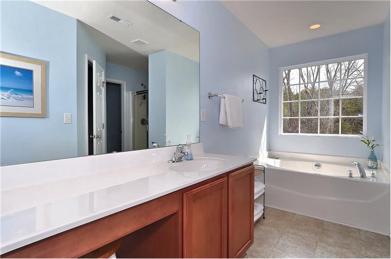 Master bathroom has dual vanities with plenty of counter space & canned lighting