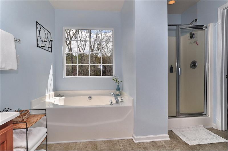 There's also a garden tub & glass-enclosed walk-in shower in the MBA