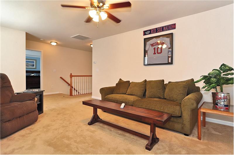 Huge bonus room with fan & wall-to-wall carpeting; could also be a large 4th bedroom