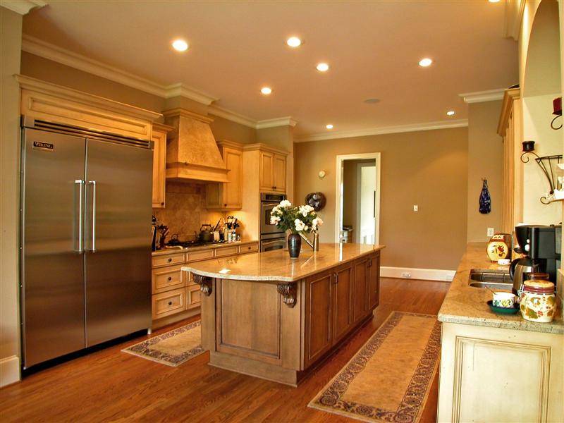 Gourmet kitchen with upgraded appliances and ample cooking space