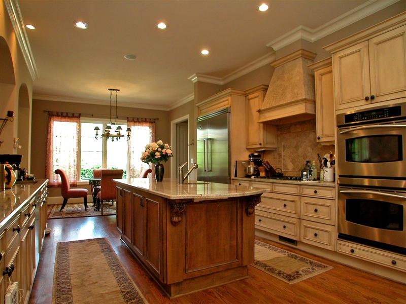 Large granite island completes this gorgeous kitchen