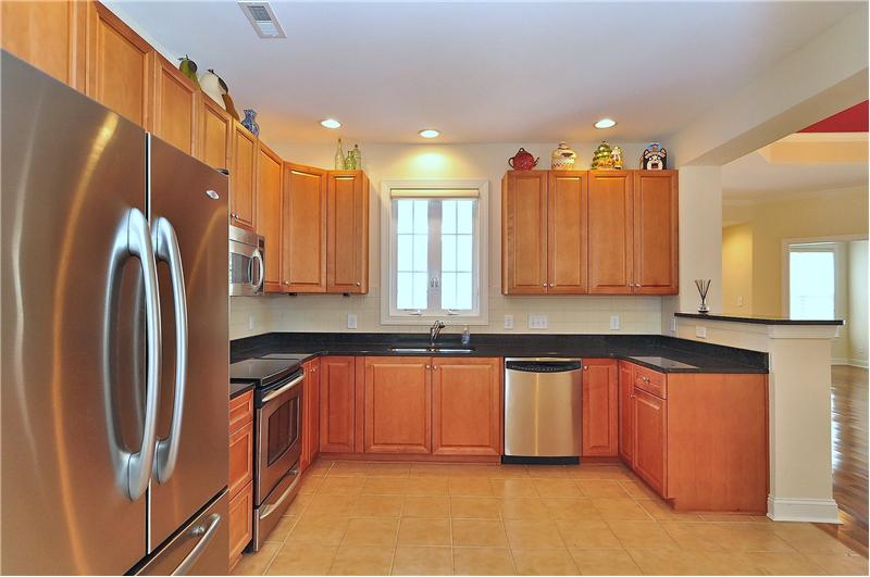 Kitchen has stainless steel appliances and plenty of counter space