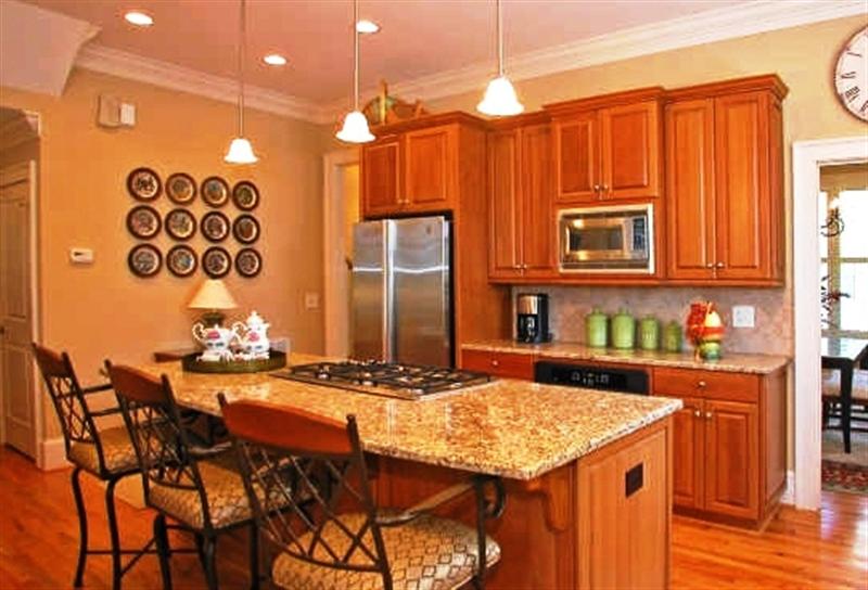 Gourmet kitchen features beautiful cherry cabinets and stainless steel appliances; refrigerator included