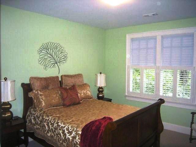 The second bedroom has wall-to-wall carpet and plantation shutters