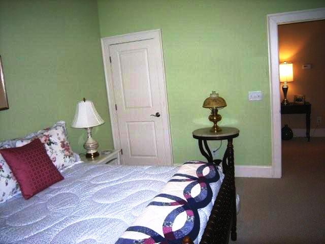 The third bedroom has wall-to-wall carpet and plantation shutters as well