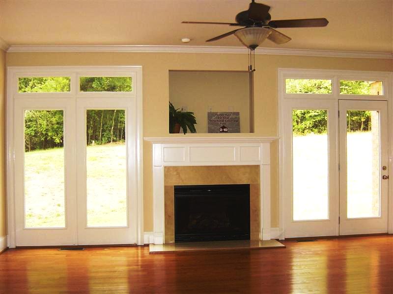 The spacious greatroom has beautiful hardwoods and a gas log marble hearth fireplace