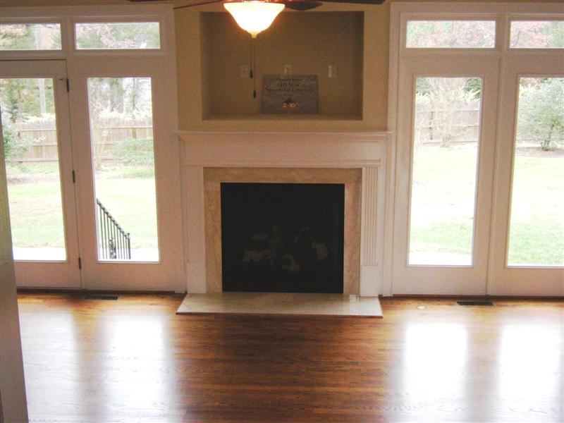Gas log fireplace with marble hearth