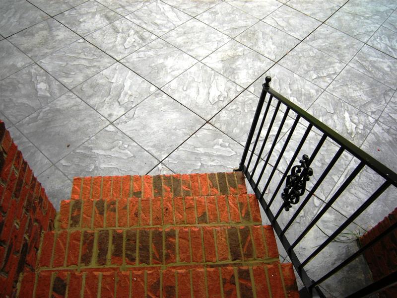 Outside stairway to the slate stamped patio