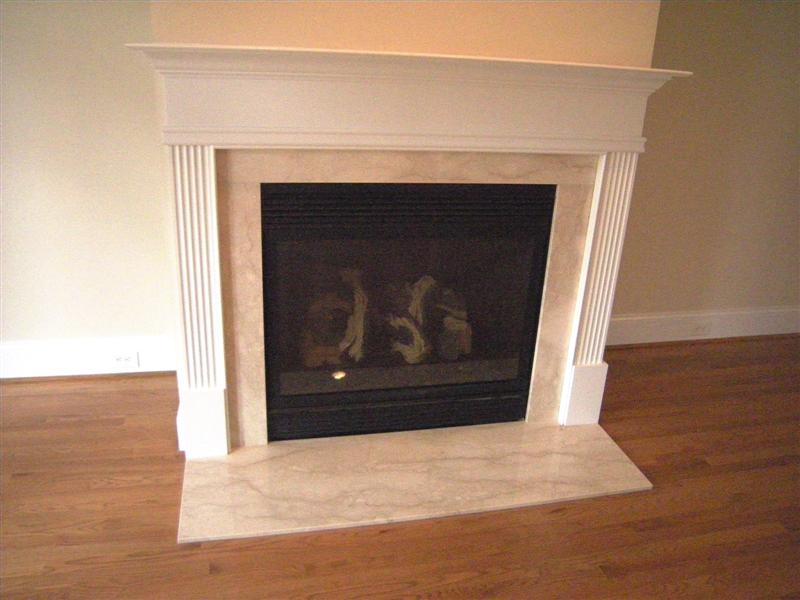 Gas log fireplace with a marble hearth