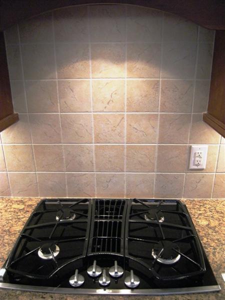 A four burner gas cooktop makes cooking fast and economical