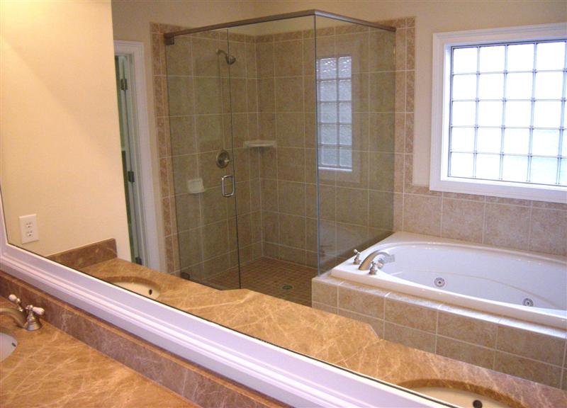 Dual vanities and a relaxing jetted, whilpool tub