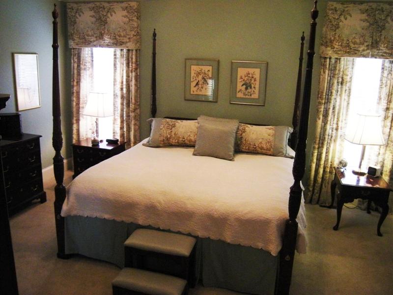 Master bedroom on the main floor has wall-to-wall carpet and custom paint