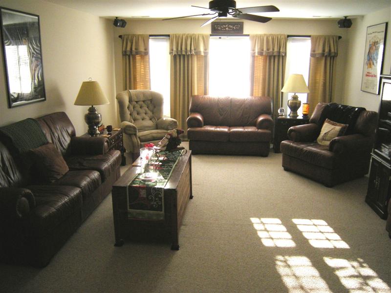 Oversized recreation room has wall-to-wall carpet