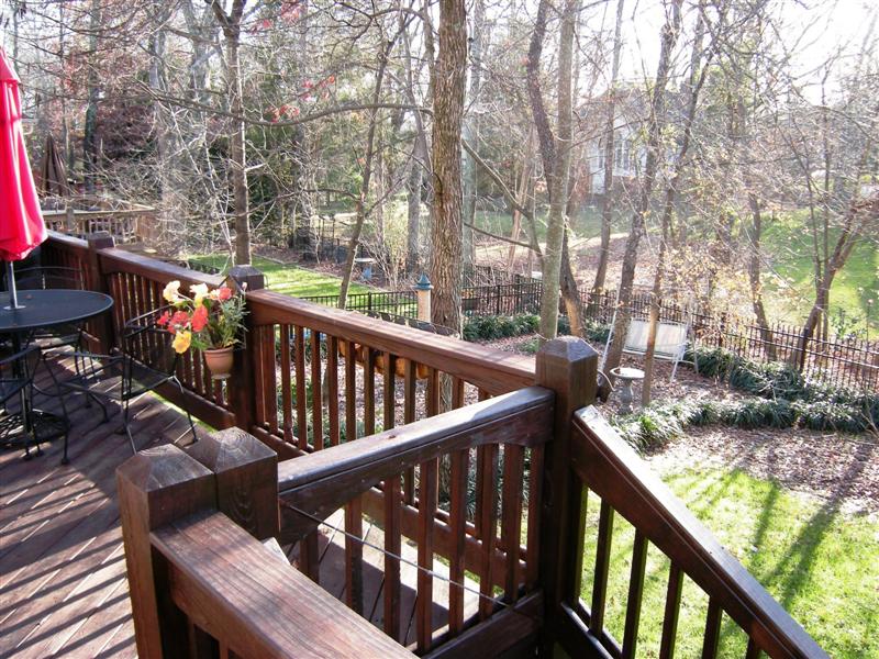 Rear yard is wooded, landscaped and fenced