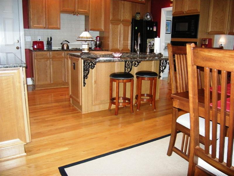 Another view of the kitchen/breakfast area and the beautiful wood floors