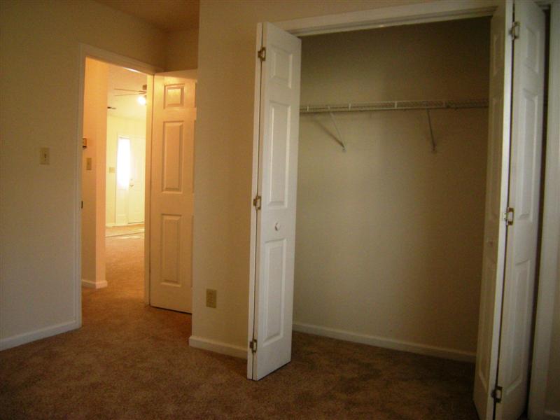 Second bedroom has double door closet, wall-to-wall carpet and fresh paint