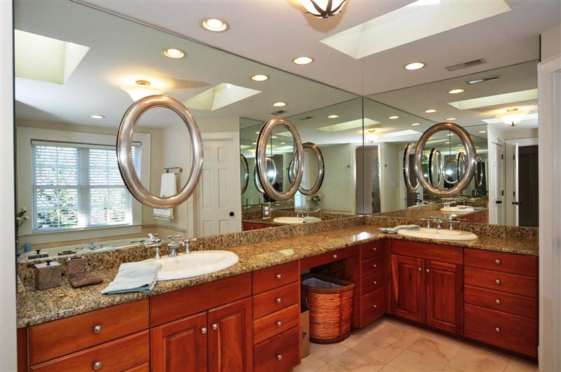 Luxurious master bath has a dual vanity, granite counter tops and three huge walk-in closets