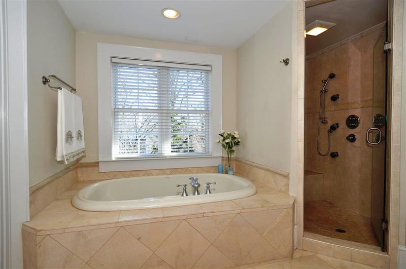 Oversized whilpool jetted tub and walk-in shower with multiple shower heads