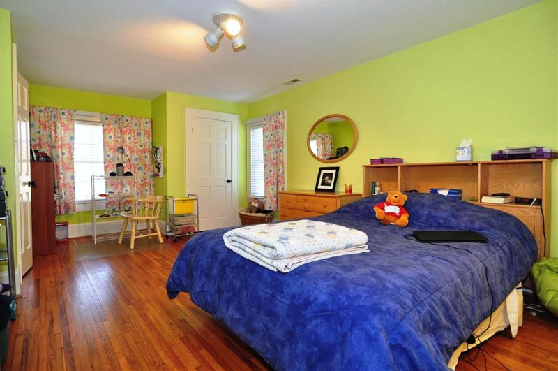 Third bedroom with wood floors and