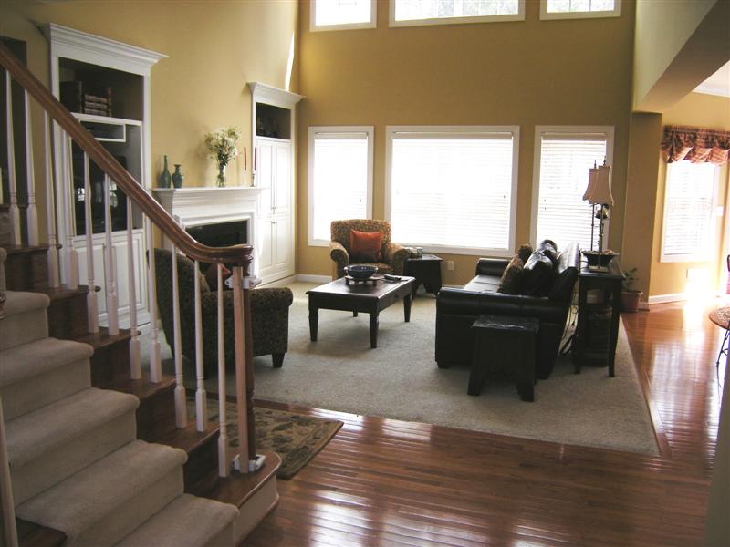 Greatroom off the foyer; beautiful hardwood flooring throughout the main level