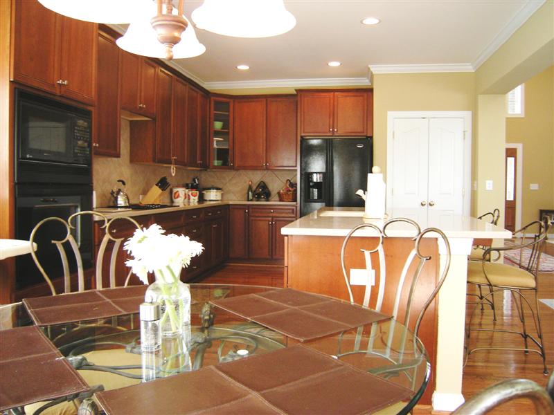 Beautiful 42inch cabinetry, oversized island/bar, pantry and included refrigerator