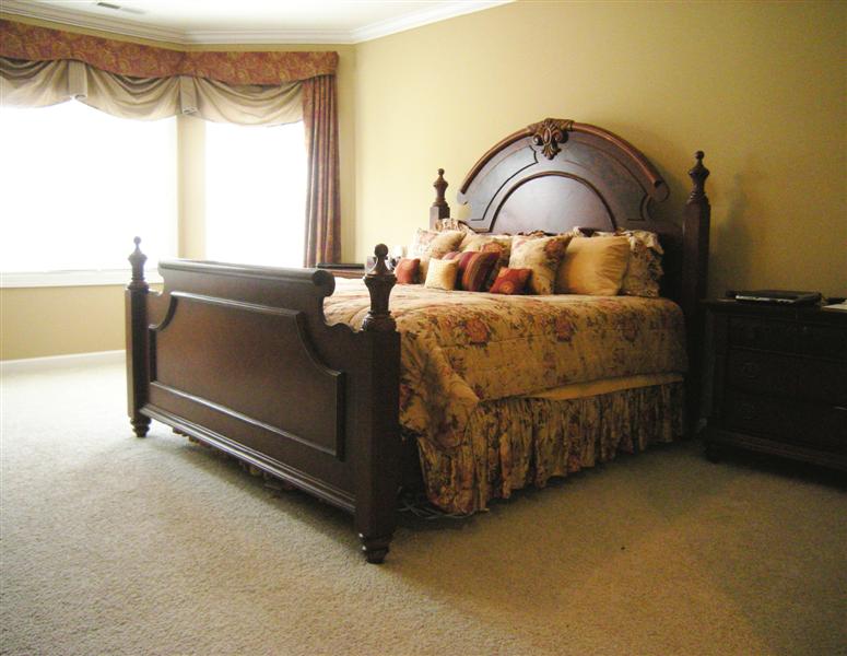 Spacious, fully carpeted master bedroom with sitting area