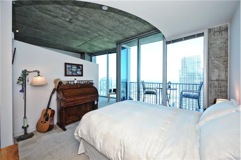 Master bedroom has wall-to-wall carpeting & incredible Uptown views