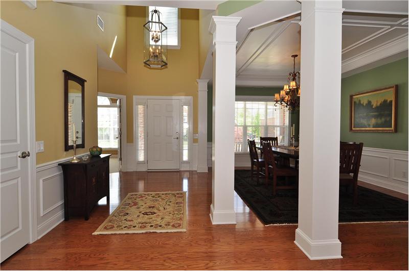Dramatic two-story foyer flanked by impressive columns
