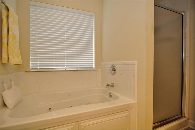 Master bath also features a jetted, whirlpool tub & walk-in shower