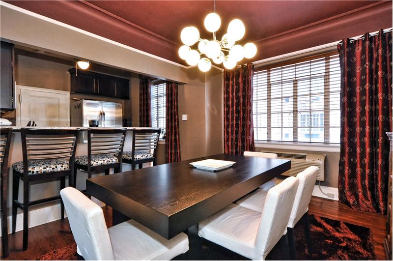 Oversized dining area with 4-seat bar area, open to kitchen are great for entertaining