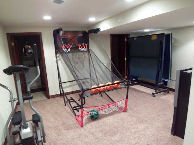 Lower level 5th bedroom w/ full bath, workout area, office or den!