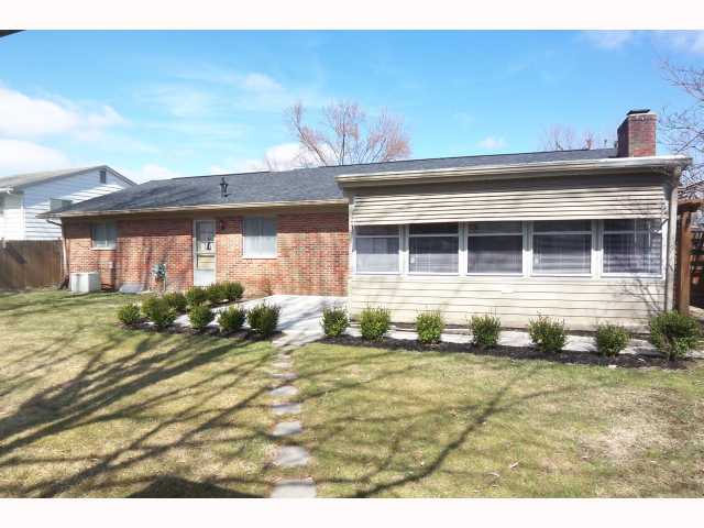 Exterior Back:   Beautifully maintained yard! Relax in your 3 season room or on your patio