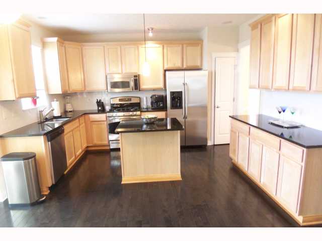 Kitchen:  Abundance of cabinets in this center island dine in kitchen with granite countertops