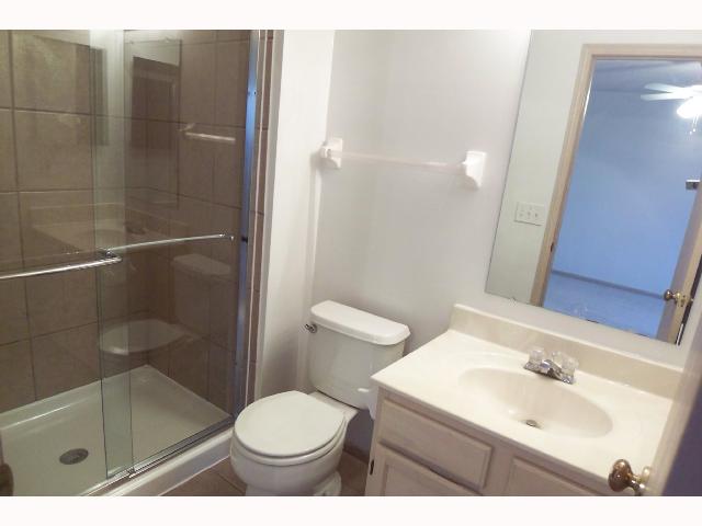 Owner Bedroom:  Remodeled master bath w/new ceramic surround shower, new tile floor