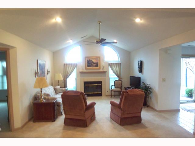 Den/Family/Great Room:  Sun-filled Vaulted ceiling great room w/gas log fireplace