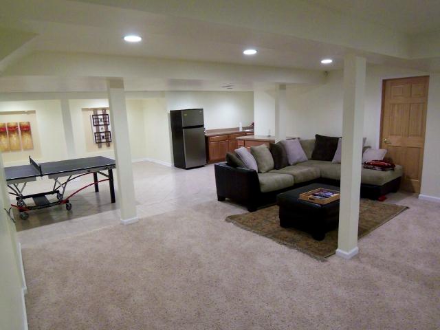 Finished lower level w/ separate room for workout, office, den
