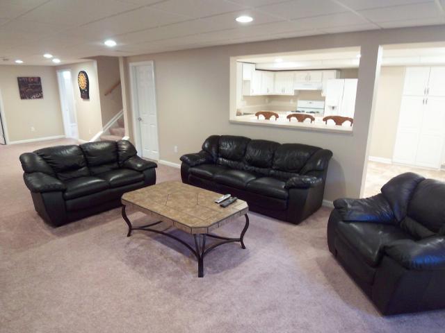 Lower level living space offers complete kitchen, living area, bedroom , full bath and laundry- great for in-laws!
