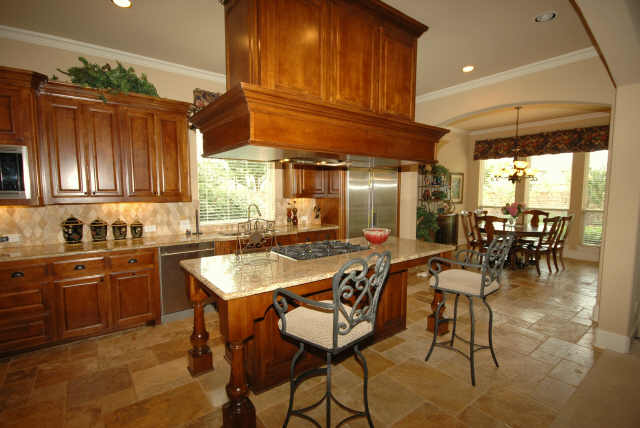 Gourmet kitchen boasts maple cabinets and top of the line appliances.